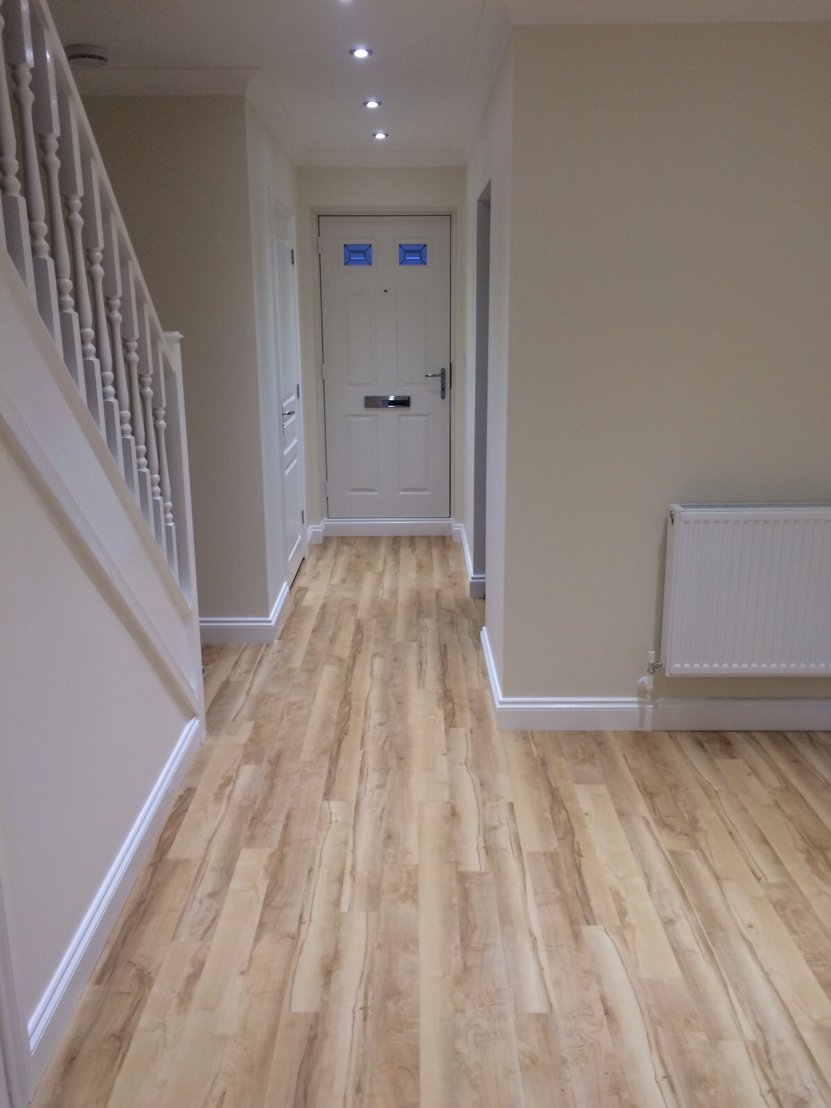 Completed hallway with fitted flooring and full interior finishing